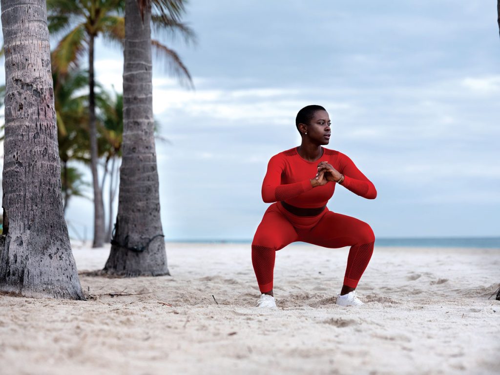 Saje Nicole, founder of The BluPrnt, works out on Fort Lauderdale Beach. Photo by Steven Martine