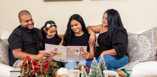 Timon and Marissa Balloo share a holiday story with their daughters, Sophie and Kirin. Photo by Jerry Rabinowitz